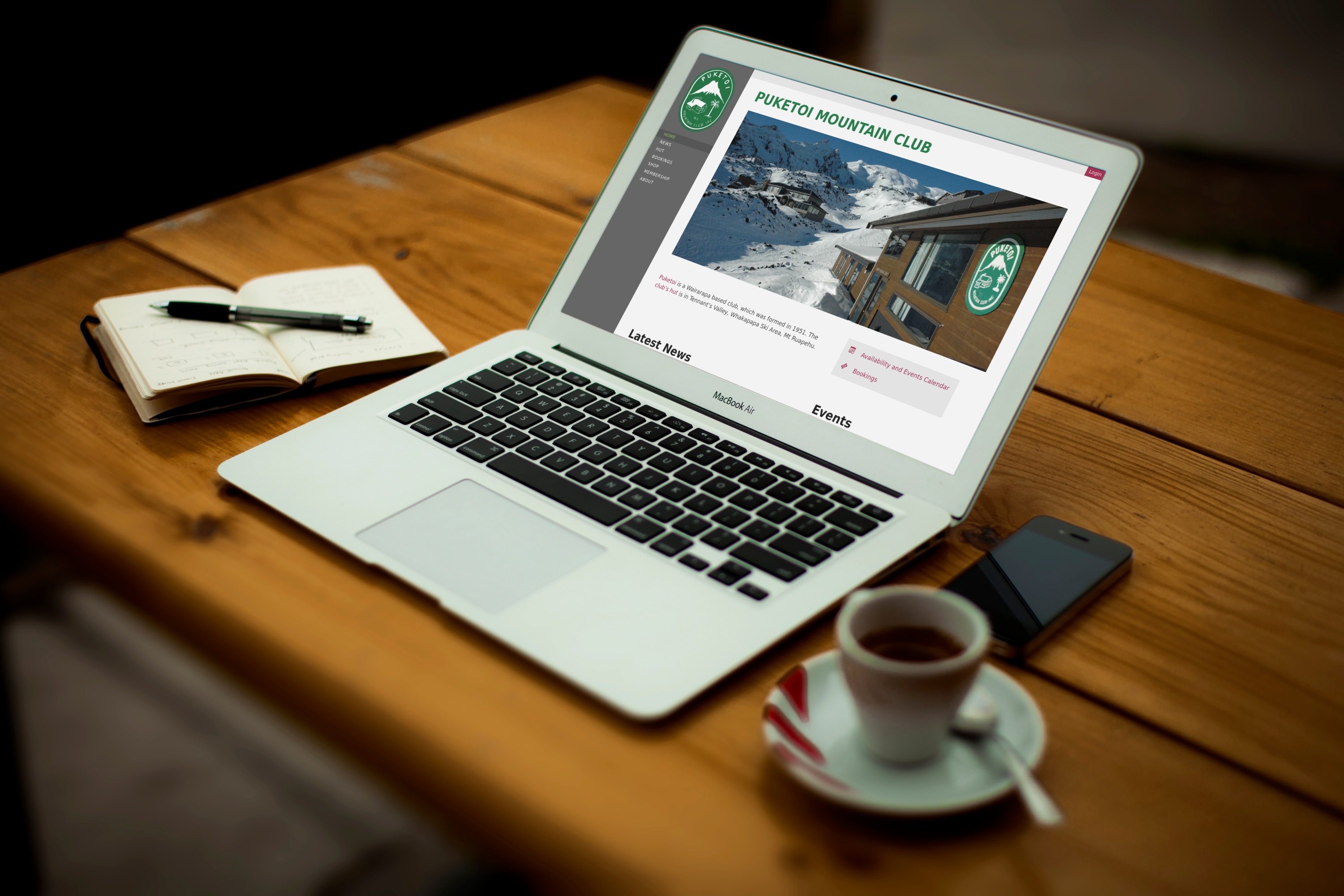 Mockup of the Puketoi Mountain Club website on a MacBook Air